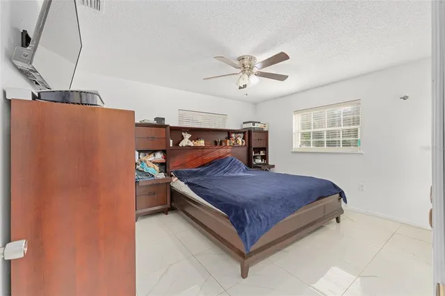 a bed room with a bed and a chandelier