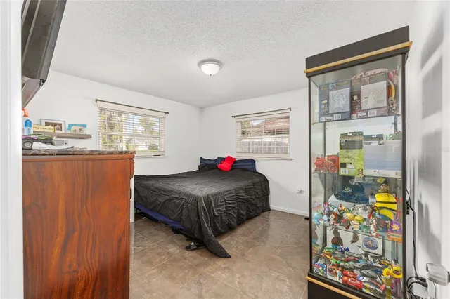 a living room with a couch and dresser