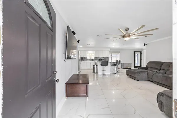 a living room with furniture and white walls