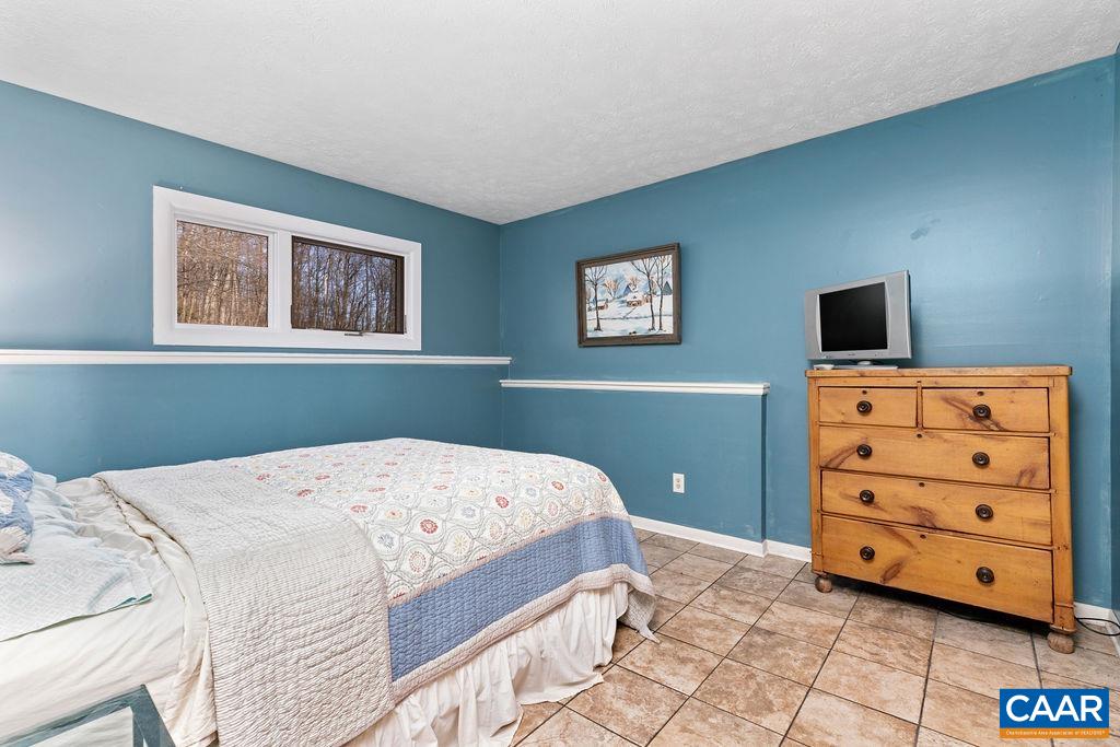 464 3 Ridges Roseland, VA 22967 - Photo 13 of 29 a bedroom with a bed and a window