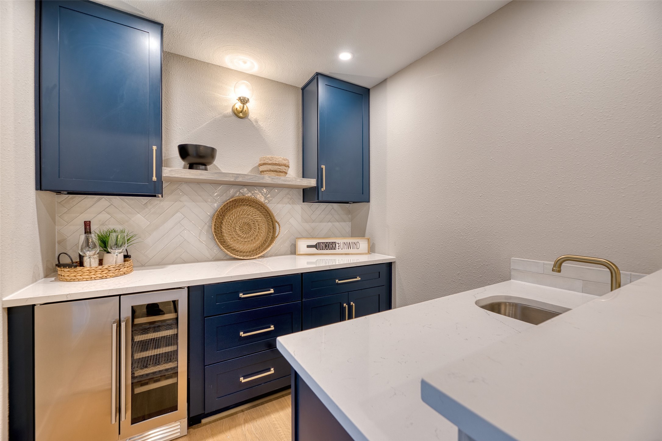 7602 Pagewood Lane Houston, TX 77063 - Photo 12 of 33 Wet bar with wine fridge makes hosting stylish and convenient.
