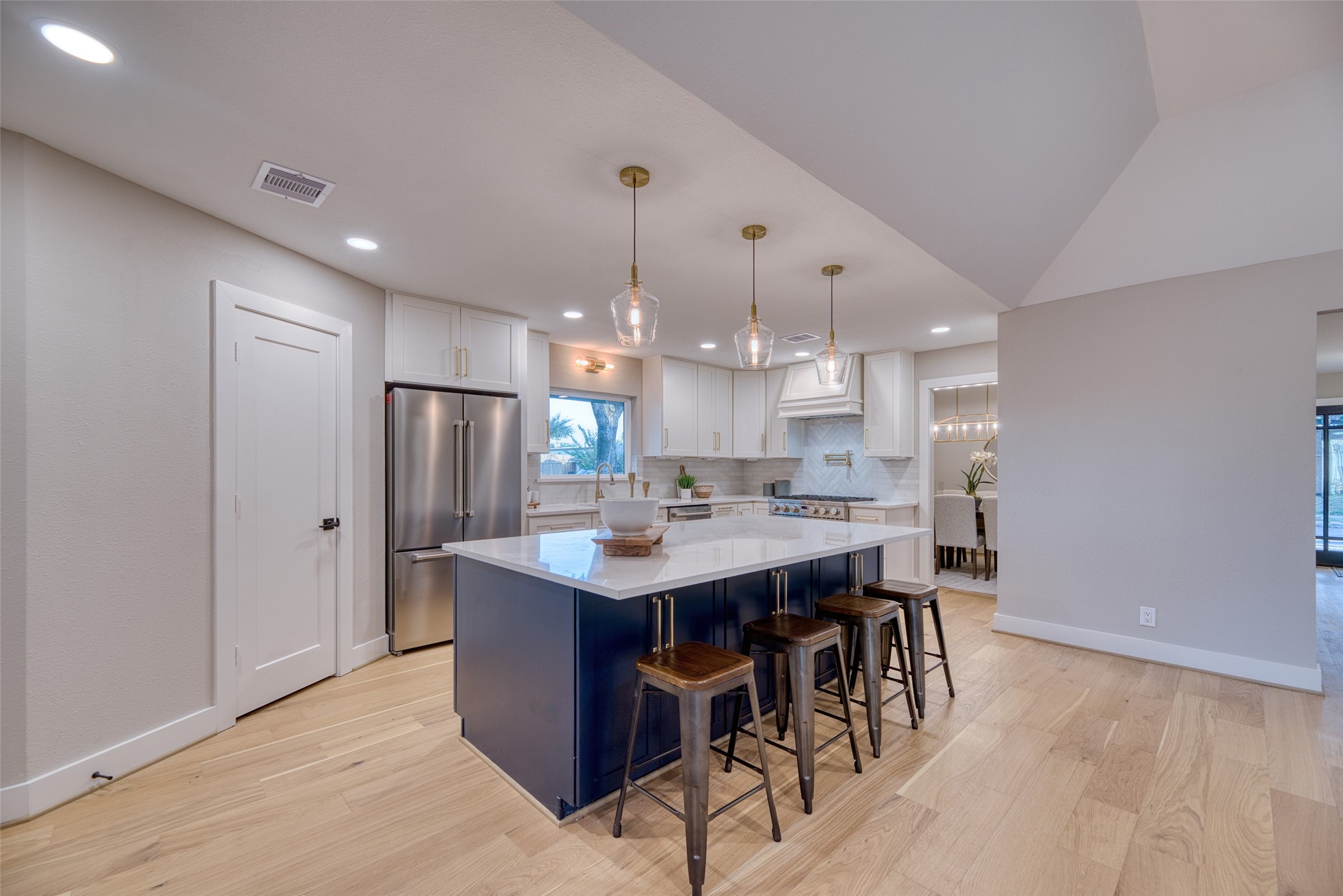 7602 Pagewood Lane Houston, TX 77063 - Photo 13 of 33 Oversized kitchen island is perfect for prep and gatherings.