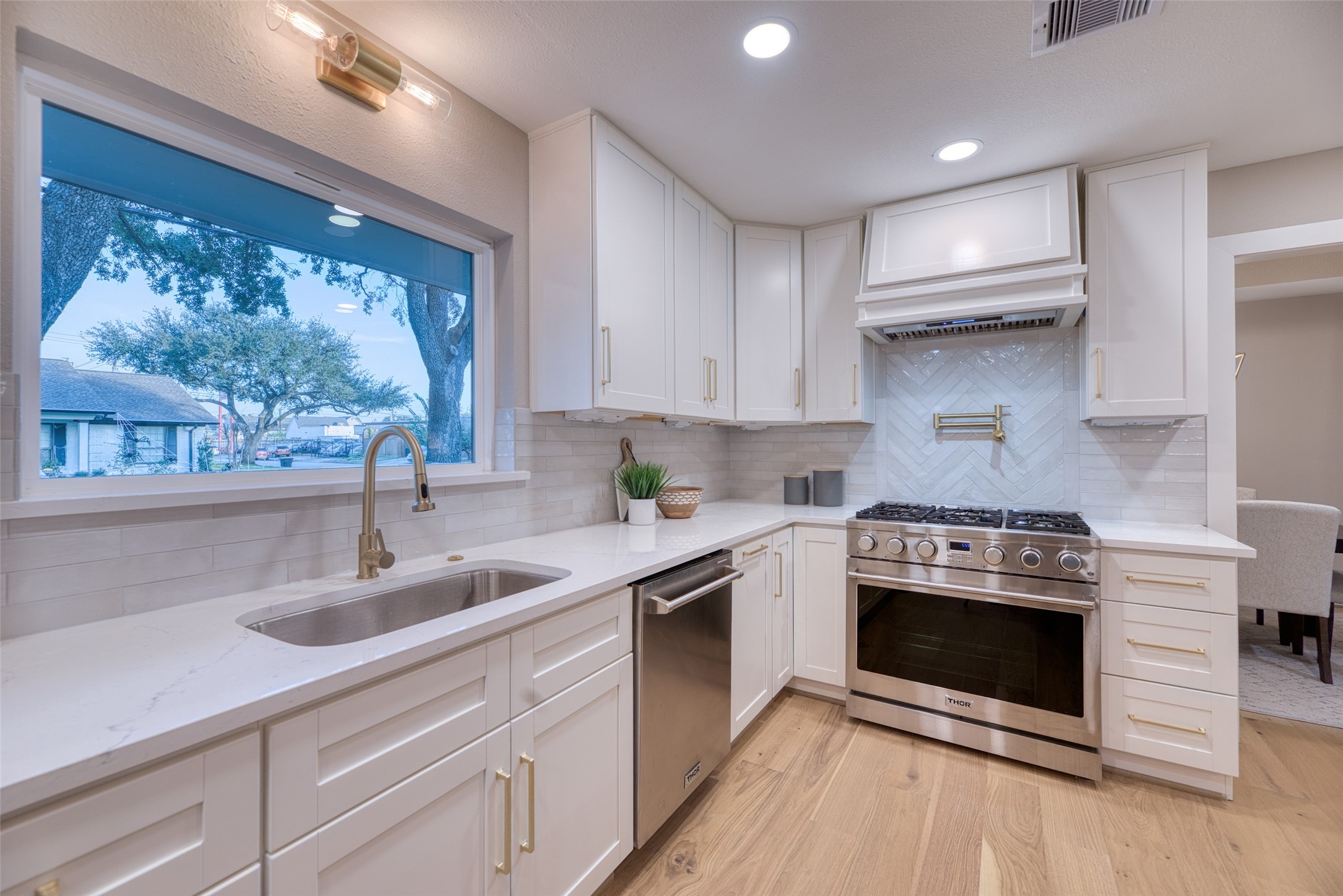 7602 Pagewood Lane Houston, TX 77063 - Photo 14 of 33 Cook with confidence using professional-grade Thor appliances, including this 36" 6-burner gas range