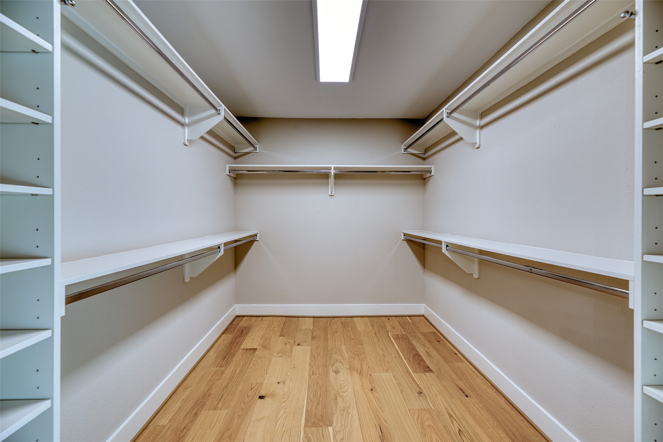7602 Pagewood Lane Houston, TX 77063 - Photo 21 of 33 Spacious walk-in closet provides abundant storage.