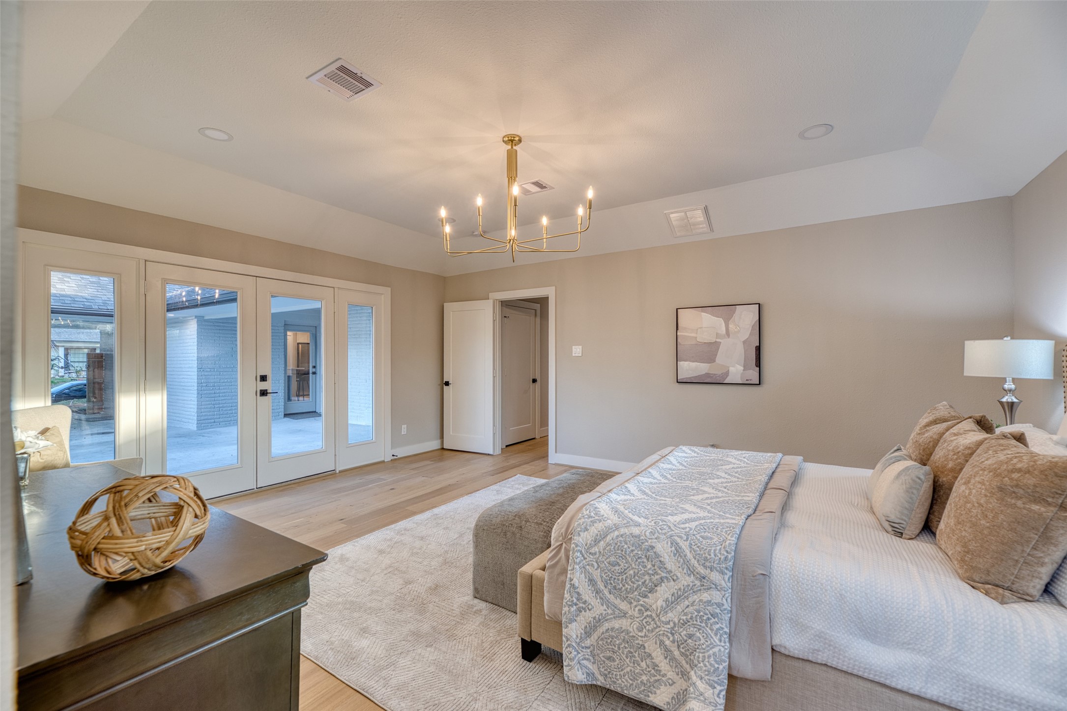 7602 Pagewood Lane Houston, TX 77063 - Photo 25 of 33 French doors open to a peaceful backyard patio.