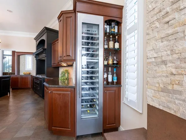 a view of kitchen with a stove and cabinets