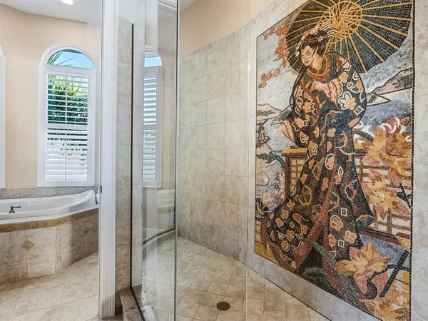 an aerial view of a house with a lake view