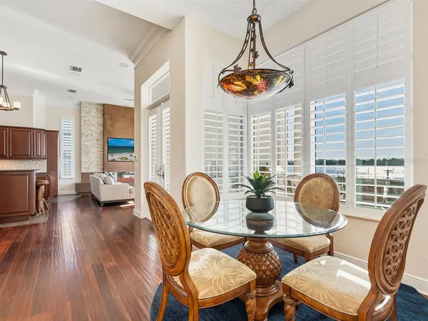 a view of a dinning table and chairs in patio