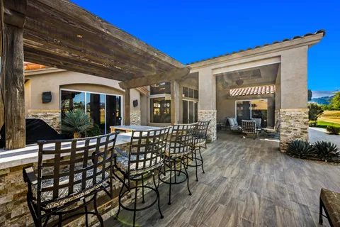 a view of a chairs and table in a patio