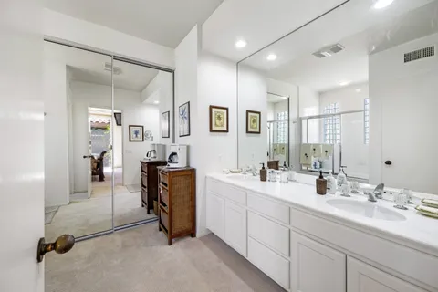 a bathroom with a glass shower door