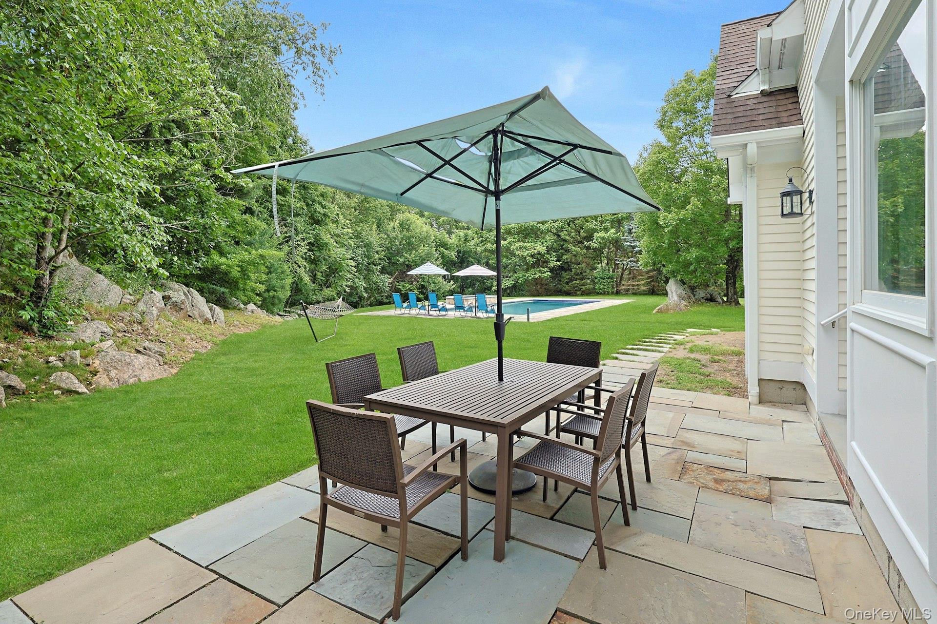17 Hammond Ridge Road Bedford Corners, NY 10549 - Photo 30 of 36 View of patio featuring outdoor dining area.