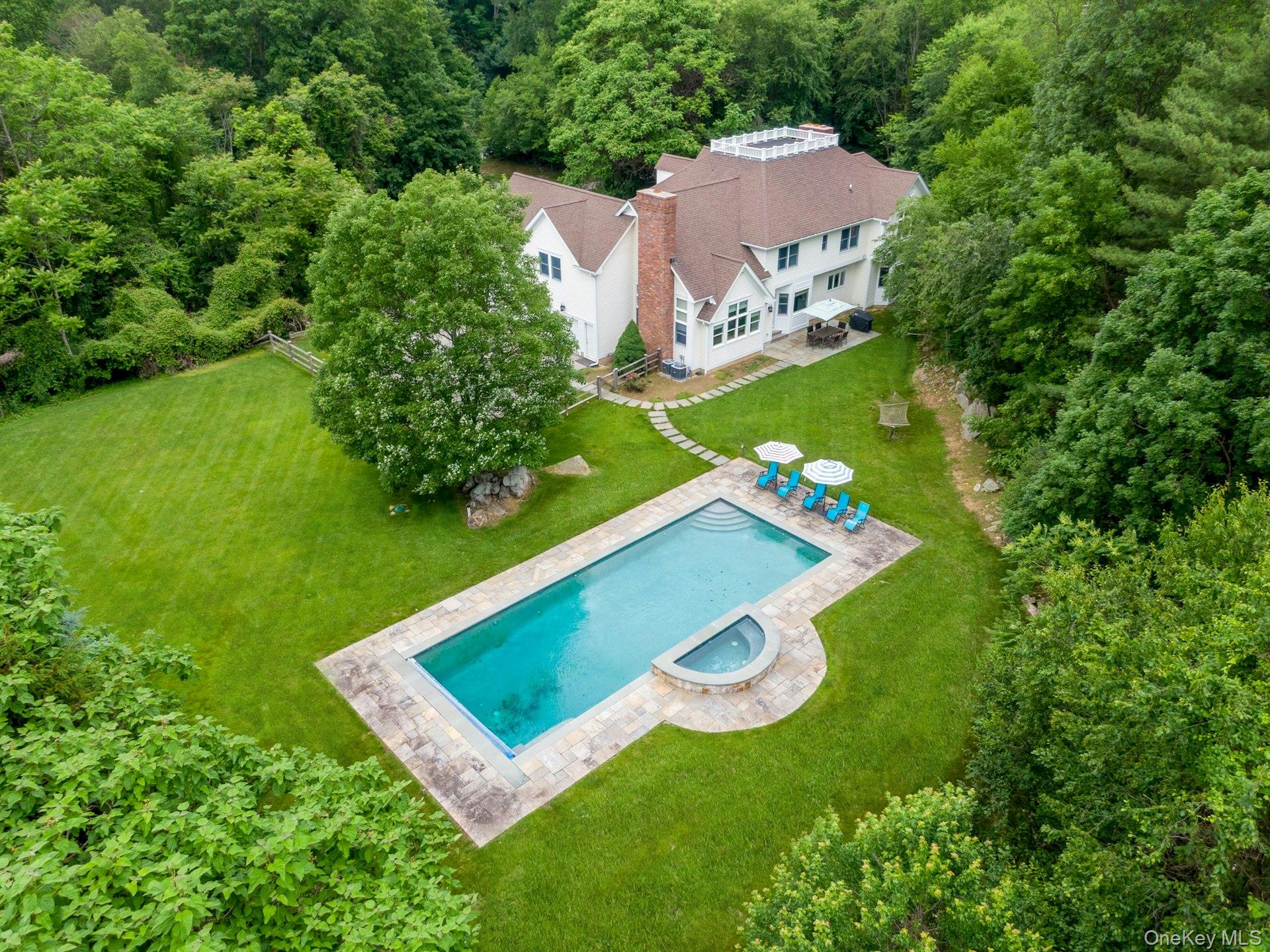 17 Hammond Ridge Road Bedford Corners, NY 10549 - Photo 32 of 36 Aerial view of pool with home and property in the background.