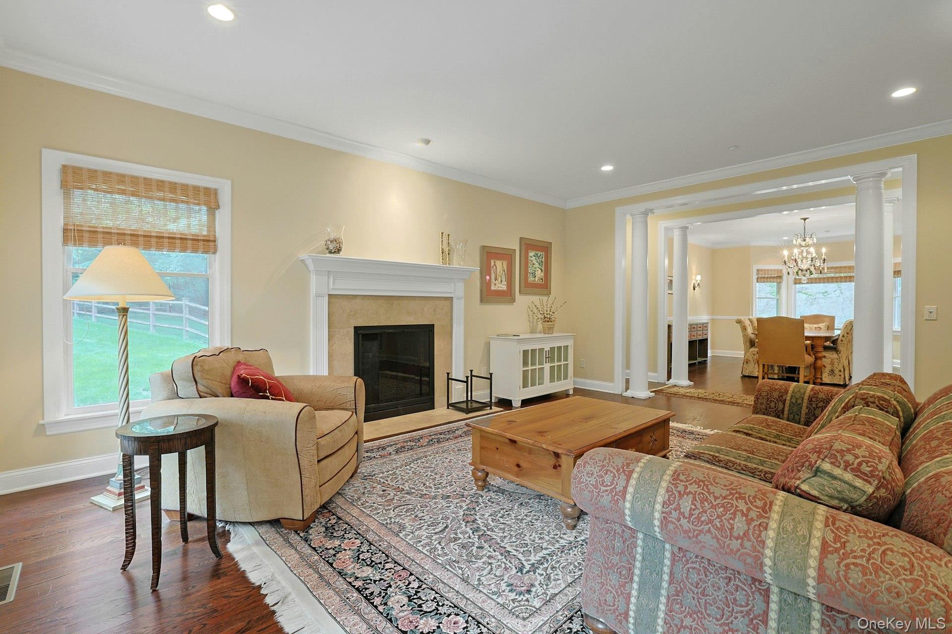 17 Hammond Ridge Road Bedford Corners, NY 10549 - Photo 5 of 36 Living Room with wood floors, crown molding, recessed lighting and wood burning fireplace.