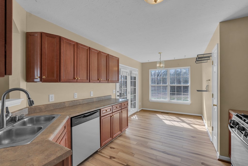 164 Prosperity Lane Sparta, TN 38583 - Photo 11 of 39 a kitchen with stainless steel appliances granite countertop a sink stove and cabinets