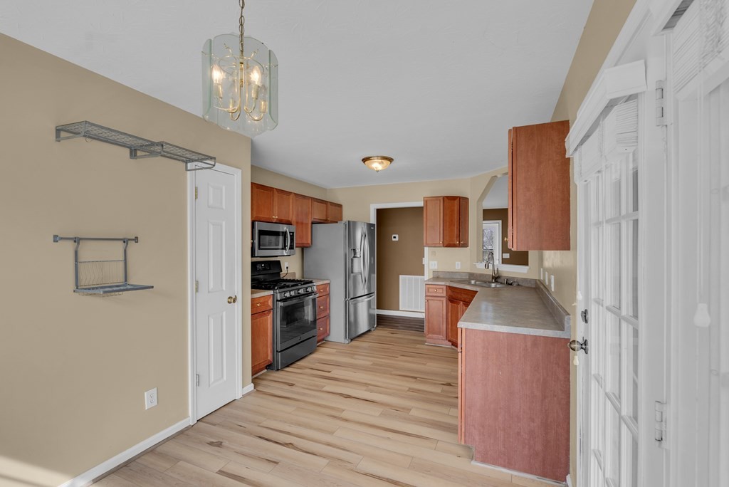 164 Prosperity Lane Sparta, TN 38583 - Photo 12 of 39 a large kitchen with a large counter top appliances and cabinets