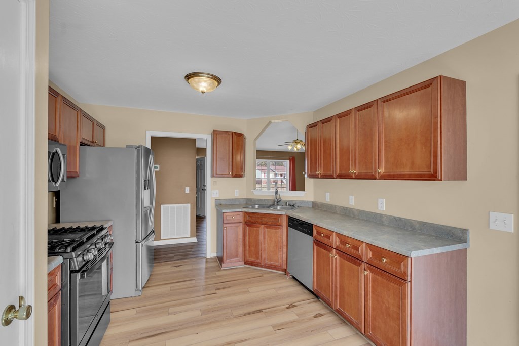 164 Prosperity Lane Sparta, TN 38583 - Photo 13 of 39 a kitchen with stainless steel appliances granite countertop a stove a sink dishwasher and a refrigerator