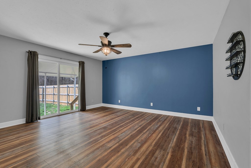 164 Prosperity Lane Sparta, TN 38583 - Photo 16 of 39 a view of an empty room with wooden floor and a window