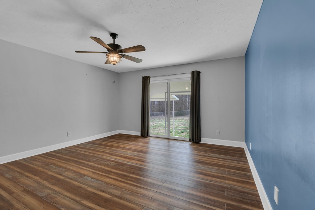164 Prosperity Lane Sparta, TN 38583 - Photo 18 of 39 wooden floor in an empty room with a window