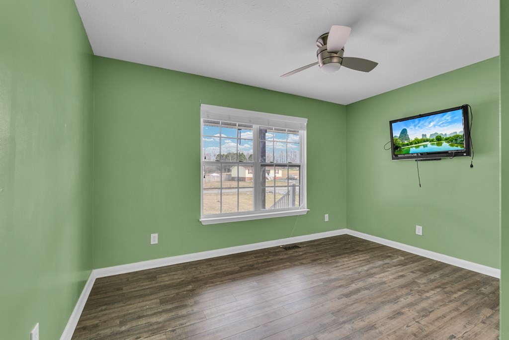 164 Prosperity Lane Sparta, TN 38583 - Photo 22 of 39 a view of empty room with wooden floor and fan