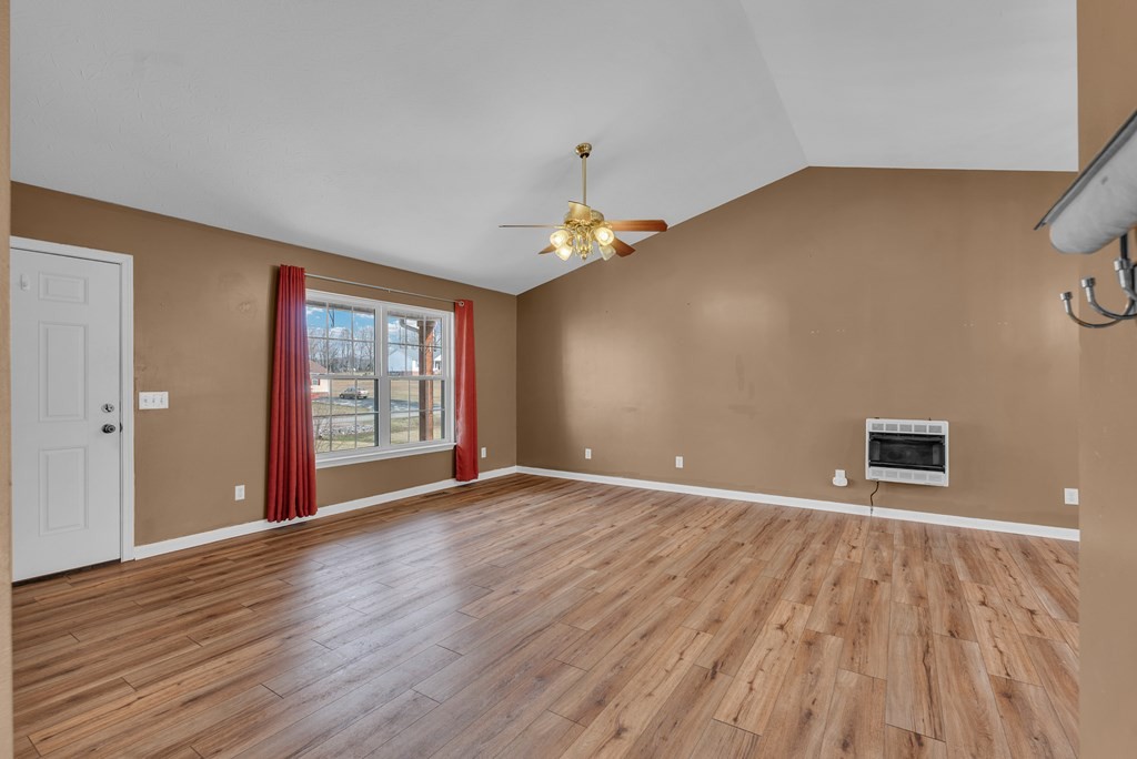 164 Prosperity Lane Sparta, TN 38583 - Photo 5 of 39 a view of an empty room with a window and wooden floor