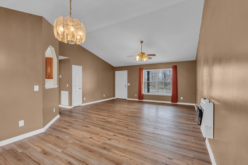 164 Prosperity Lane Sparta, TN 38583 - Photo 6 of 39 a view of an empty room with wooden floor and a window
