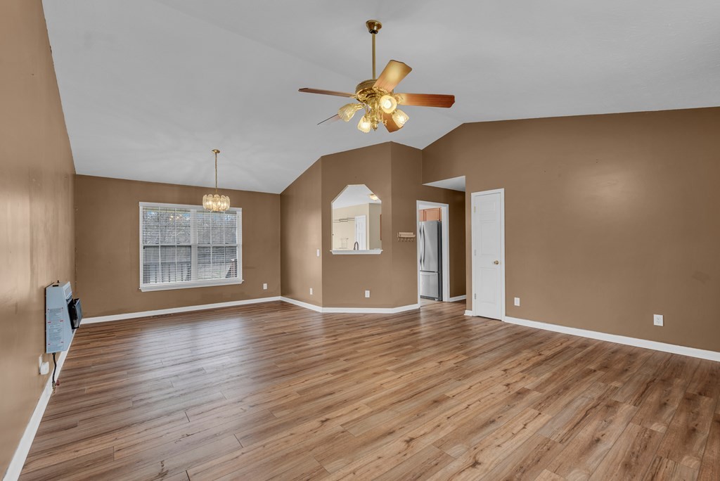 164 Prosperity Lane Sparta, TN 38583 - Photo 7 of 39 a view of an empty room with window and wooden floor