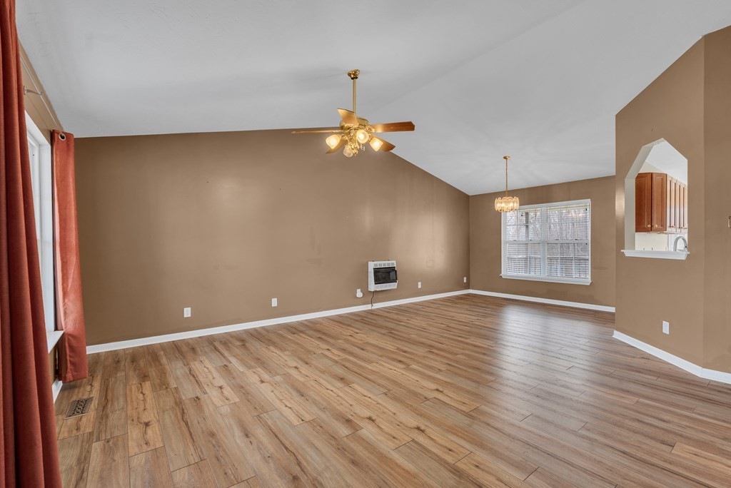 164 Prosperity Lane Sparta, TN 38583 - Photo 8 of 39 a view of an empty room with window and wooden floor