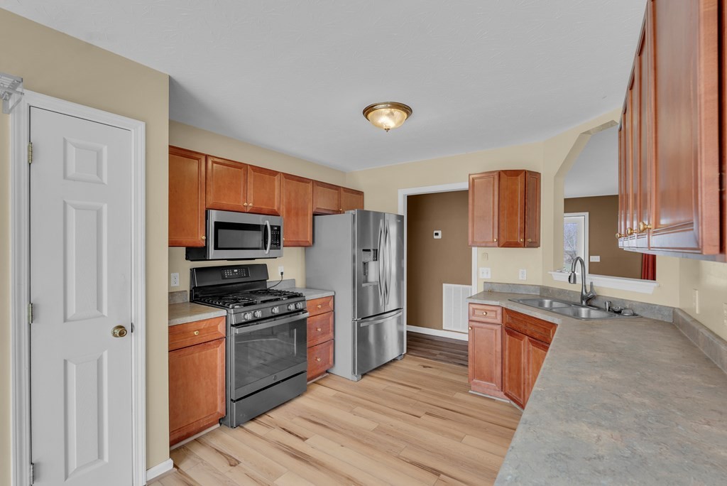 164 Prosperity Lane Sparta, TN 38583 - Photo 10 of 39 a kitchen with stainless steel appliances granite countertop a refrigerator stove microwave and sink