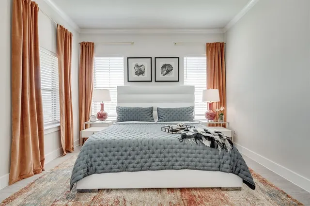 a bedroom with a bed and window