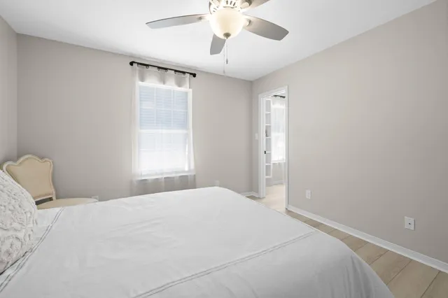 a view of a hallway with wooden floor and a hallway