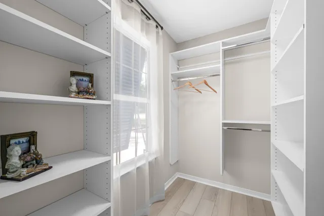 a bathroom with a tub a sink and shower