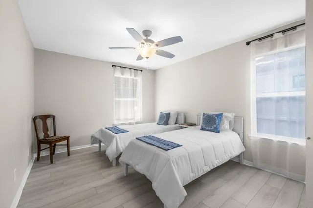 a view of a dining room with furniture and a chandelier