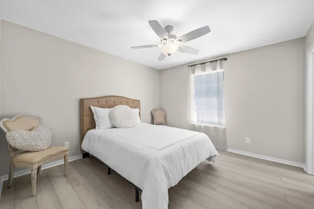 a bathroom with a tub a sink and shower