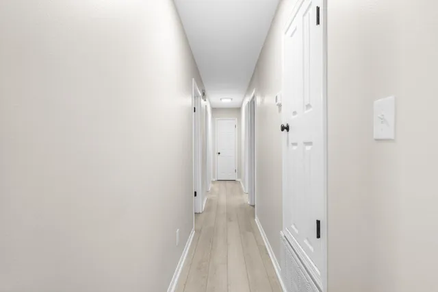 a view of a roof deck with couches and pool