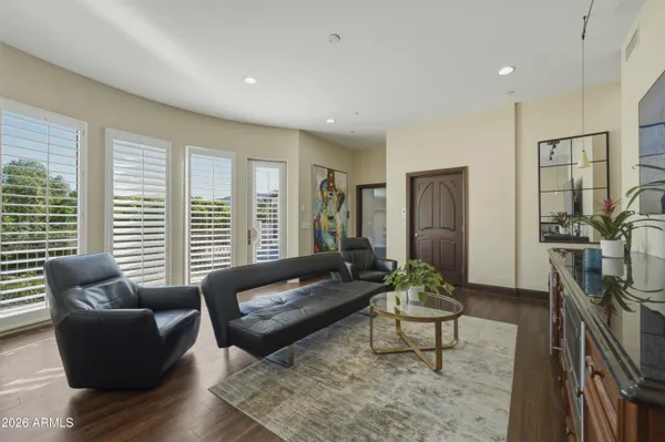 a view of a garage with a couch and a chandelier