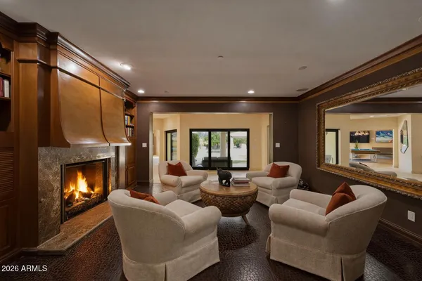 a dining room with furniture and wooden floor