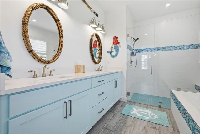 a bathroom with a tub sink and mirror