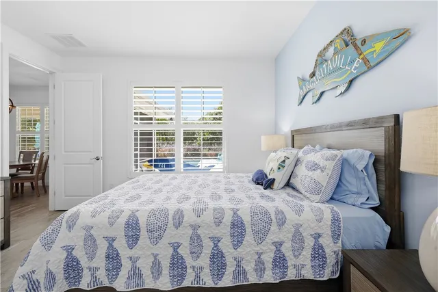a bathroom with a granite countertop toilet sink and mirror