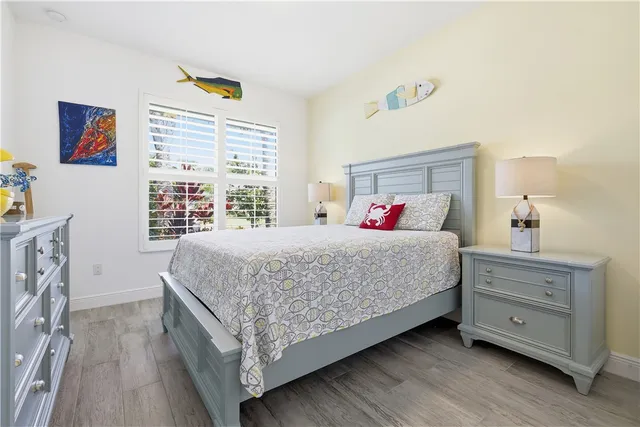 a bathroom with a granite countertop sink mirror vanity and toilet