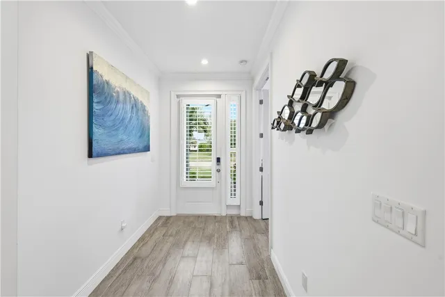 a view of a room with window and wooden floor