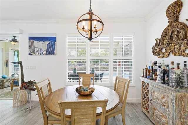 a kitchen with a dining table and chairs
