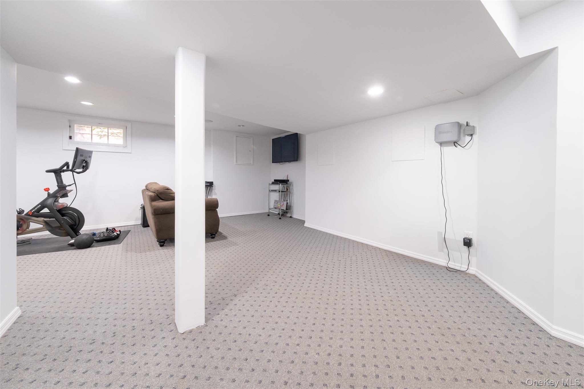 24 Sheldrake Place New Rochelle, NY 10804 - Photo 23 of 26 Basement featuring carpet, recessed lighting, and baseboards