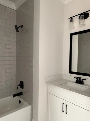 a bathroom with a sink and a bathtub