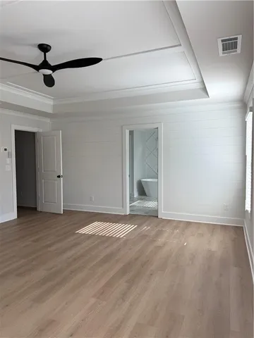 a view of an empty room with a chandelier