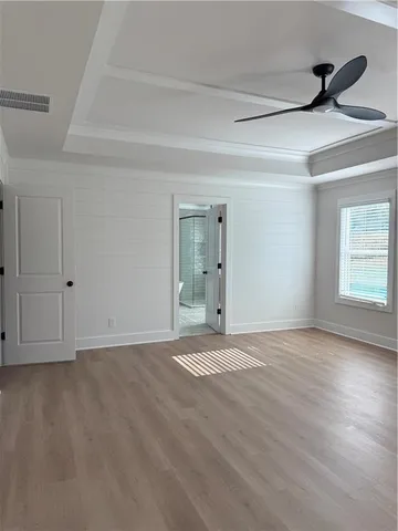 a view of an empty room and a window