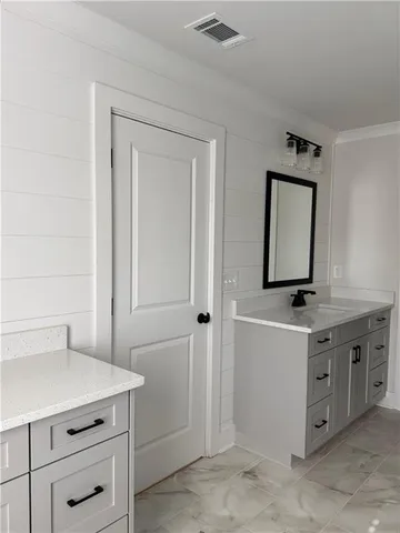 a room with a cabinets and a dresser