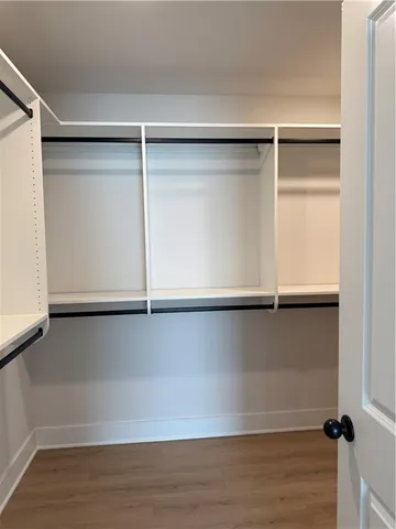 a view of an empty walk in closet