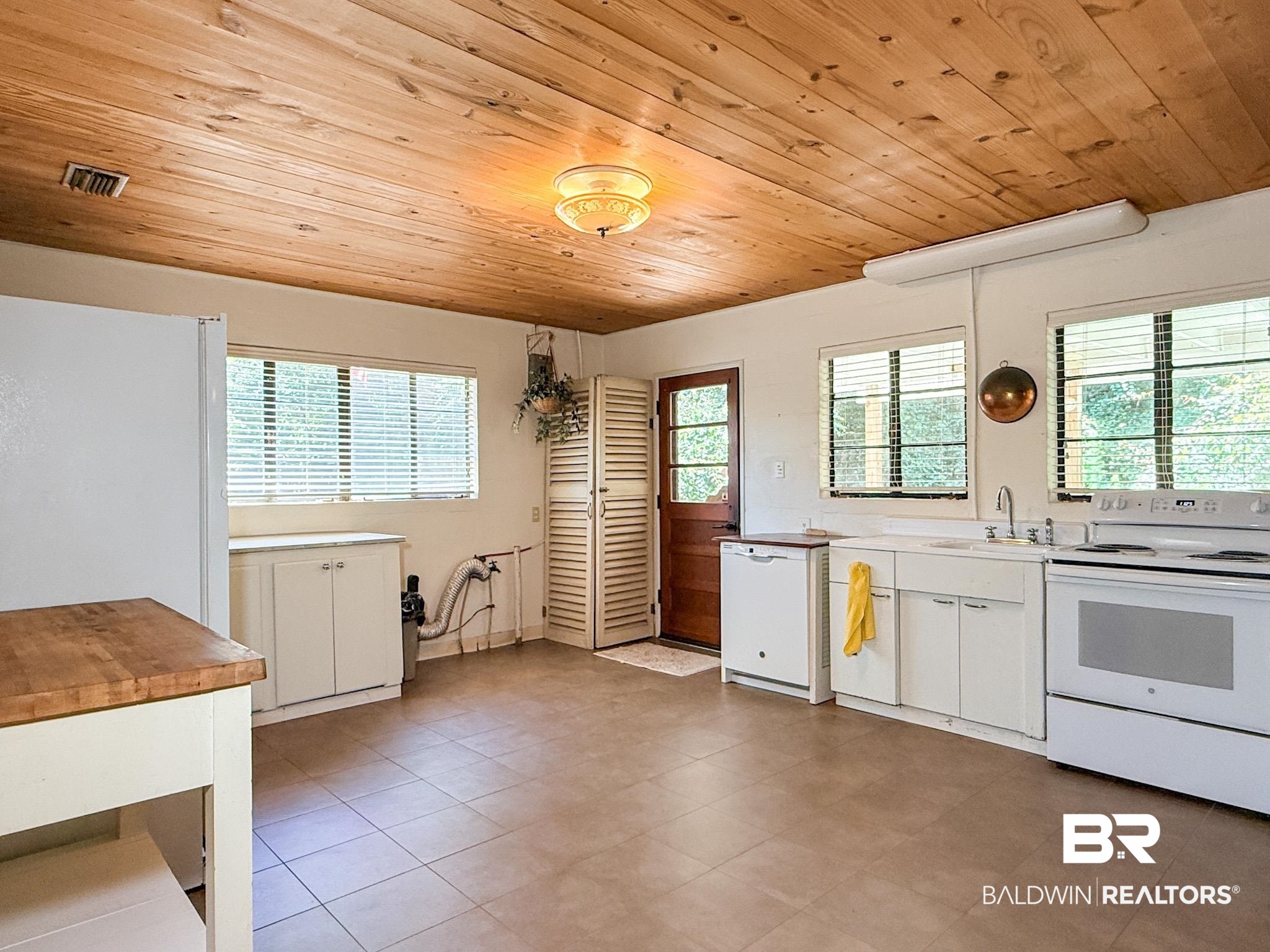 18711 Keller Road Foley, AL 36535 - Photo 14 of 38 Wood-plank ceiling with a flush-mount light fixture