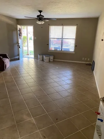 a kitchen with a sink and steel appliances