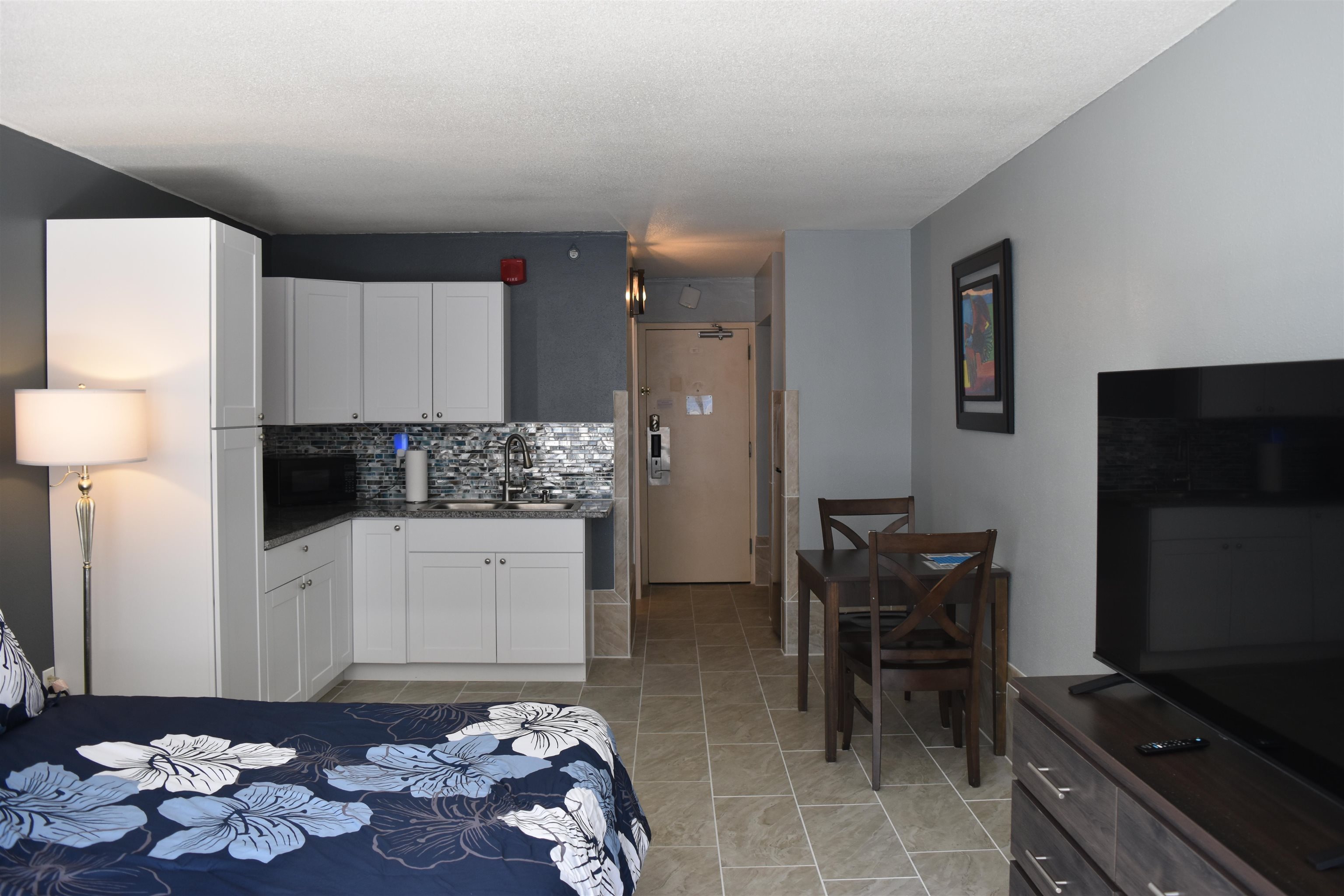 1501 South Ocean Boulevard, Unit 910 Myrtle Beach, SC 29577 - Photo 2 of 31 Bedroom featuring a sink and light tile patterned floors